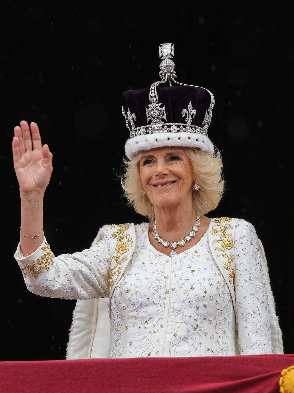 Queen Camilla waves from the balcony of Buckingham Palace after the coronation ceremony on May 6, 2023 (Julie Edwards/Alamy)
