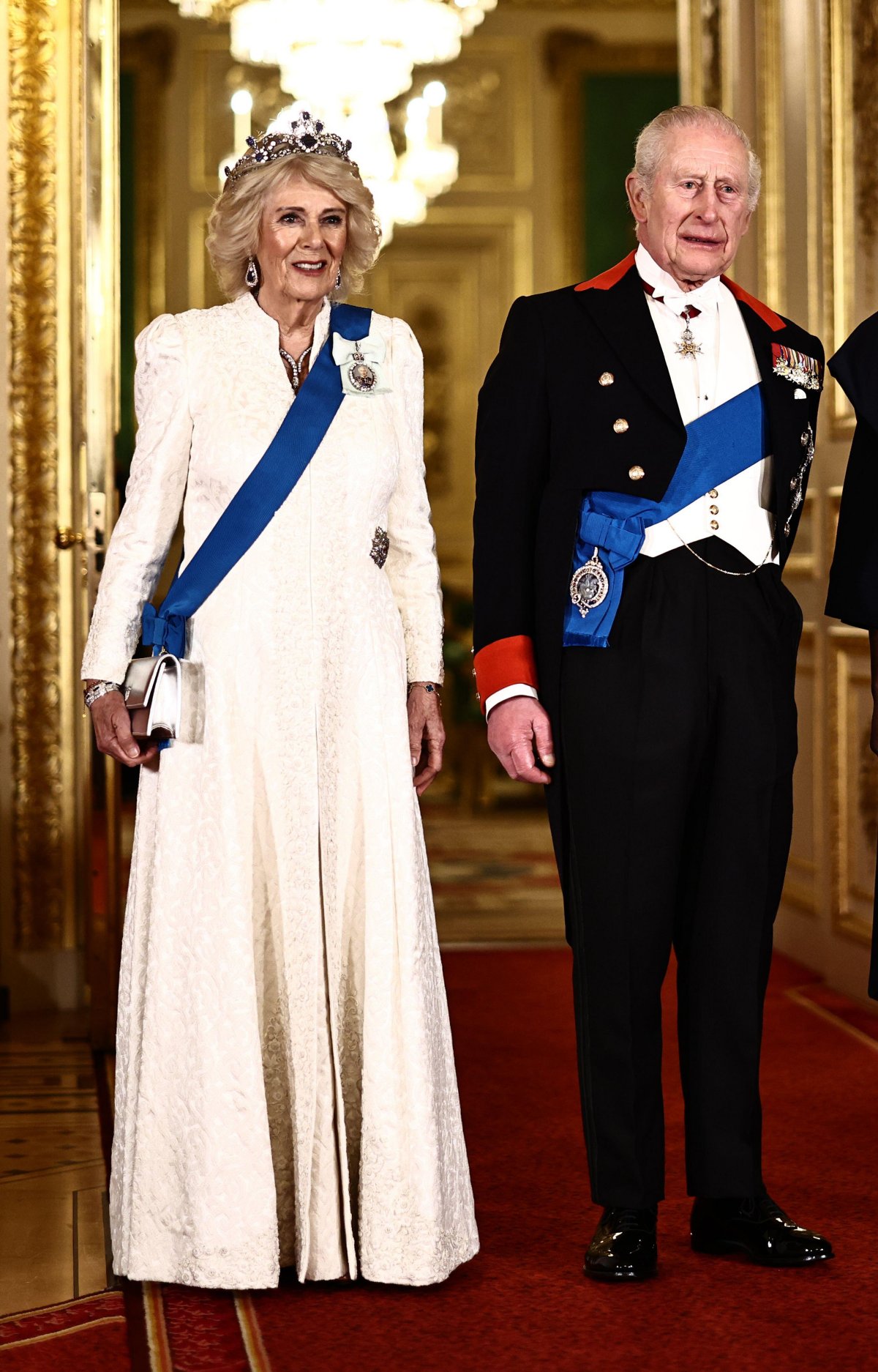 King Charles III and Queen Camilla are pictured ahead of a state banquet in honor of the President of Nigeria at Windsor Castle on March 18, 2026 (Henry Nicholls/PA Images/Alamy)