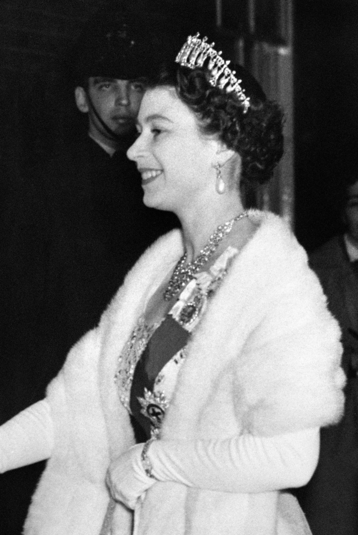 Queen Elizabeth II and the Duke of Edinburgh arrive for a dinner party given by Winston and Clementine Churchill at Downing Street in London on April 4, 1955 (PA Images/Alamy)