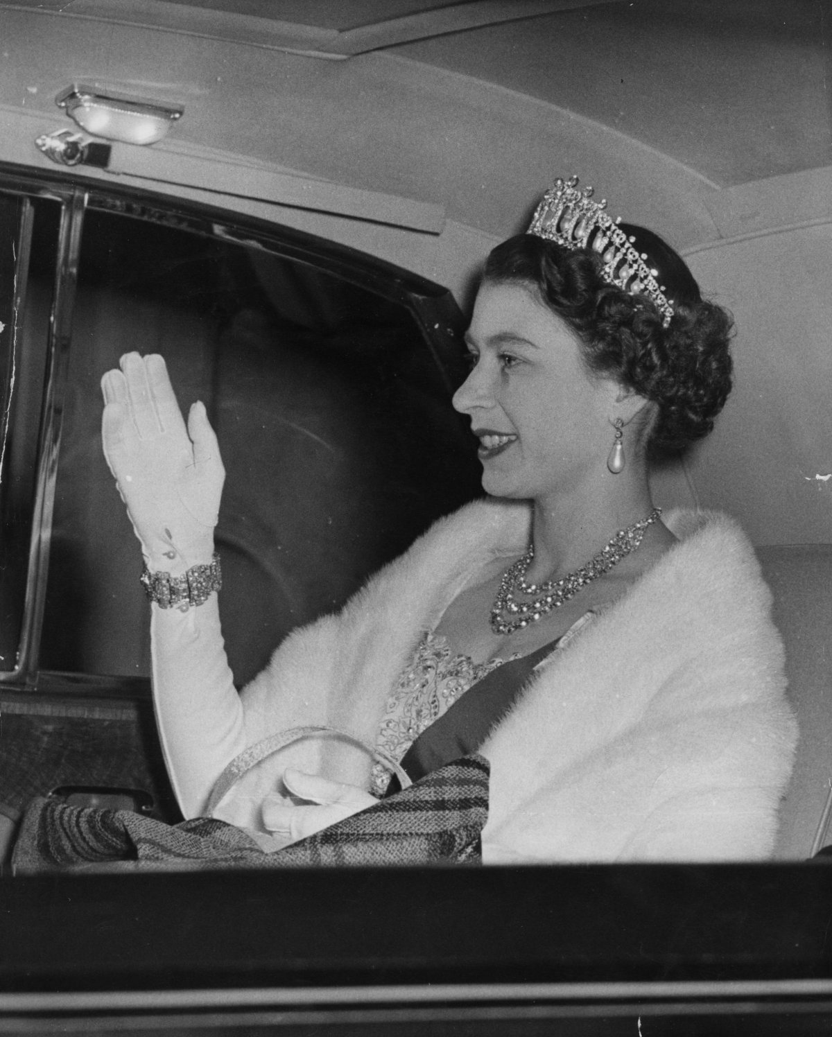 Queen Elizabeth II and the Duke of Edinburgh arrive for a dinner party given by Winston and Clementine Churchill at Downing Street in London on April 4, 1955 (PA Images/Alamy)