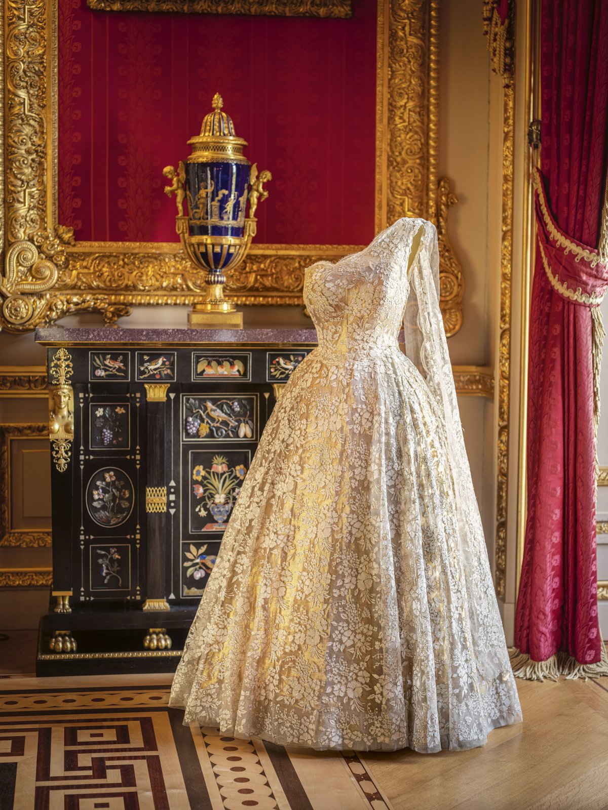 A lace evening gown, made for Queen Elizabeth II by Sir Norman Hartnell, is displayed at Buckingham Palace, 2026 (Paul Bulley/Royal Collection Trust)