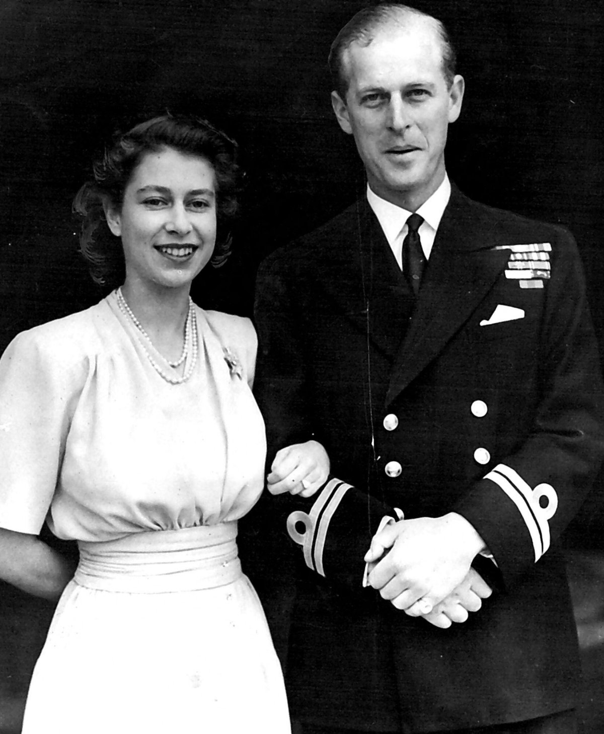 Princess Elizabeth and Lieutenant Philip Mountbatten pose for official photos after the announcement of their engagement on June 10, 1947 (