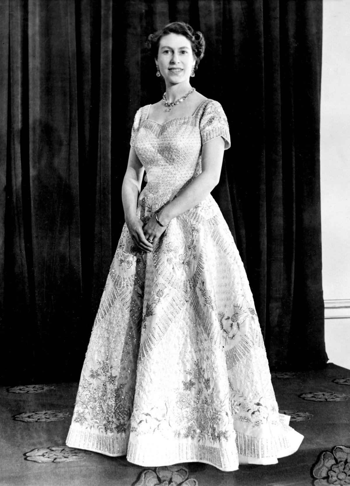 Queen Elizabeth II poses in her coronation dress, 1953 (Smith Archive/Alamy)