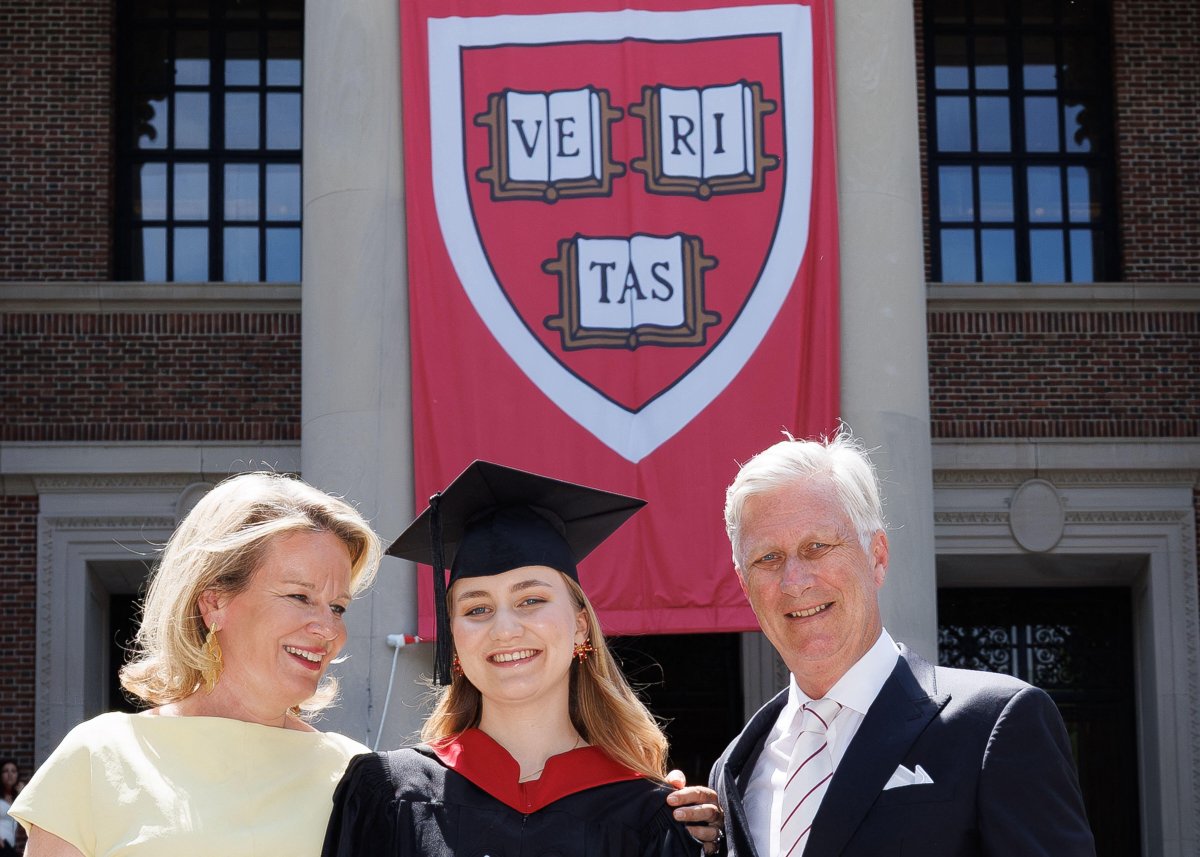 The Duchess of Brabant poses with her parents, the King and Queen of the Belgians, as she graduates from Harvard Kennedy School on May 27, 2026 (BENOIT DOPPAGNE/Belga News Agency/Alamy)