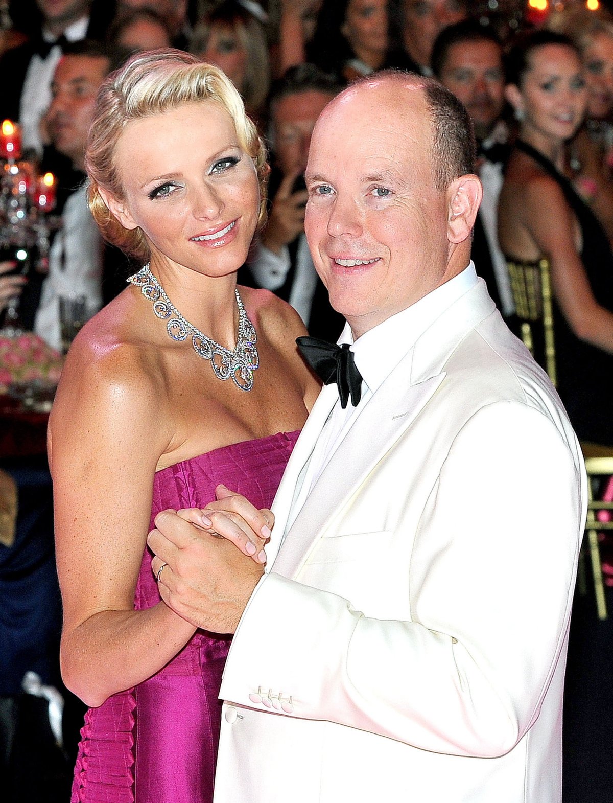 The Prince and Princess of Monaco dance during the annual Red Cross Gala in Monte Carlo on August 4, 2011 (WENN/Alamy)