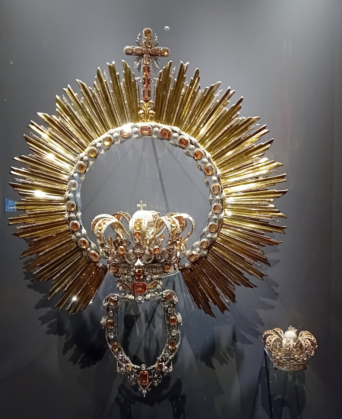 The crown, wimple, and halo of Our Lady of Atocha and the crown of the Christ Child on display at the Royal Basilica of Our Lady of Atocha, 2023 (Wikimedia Commons)