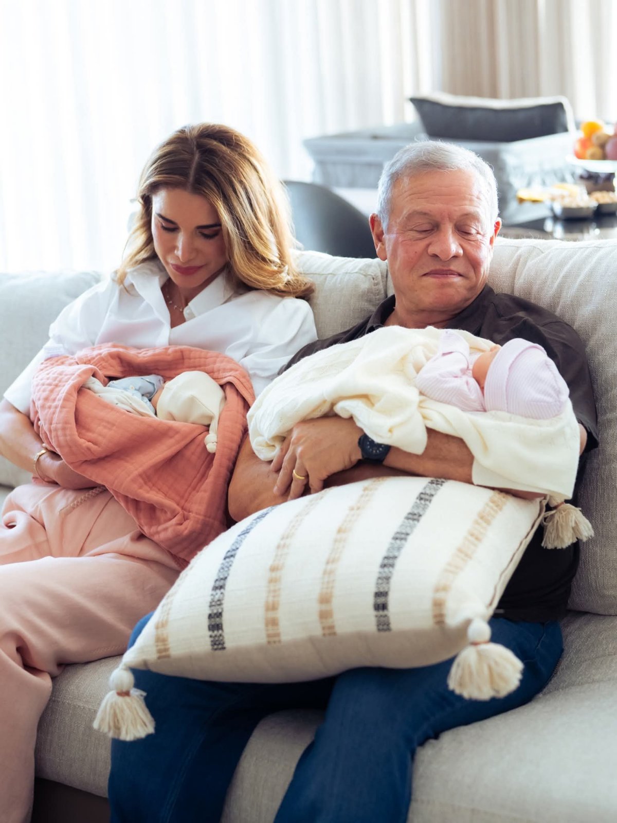 The King and Queen of Jordan hold their newborn granddaughters, Talia and Rania (Royal Hashemite Court)