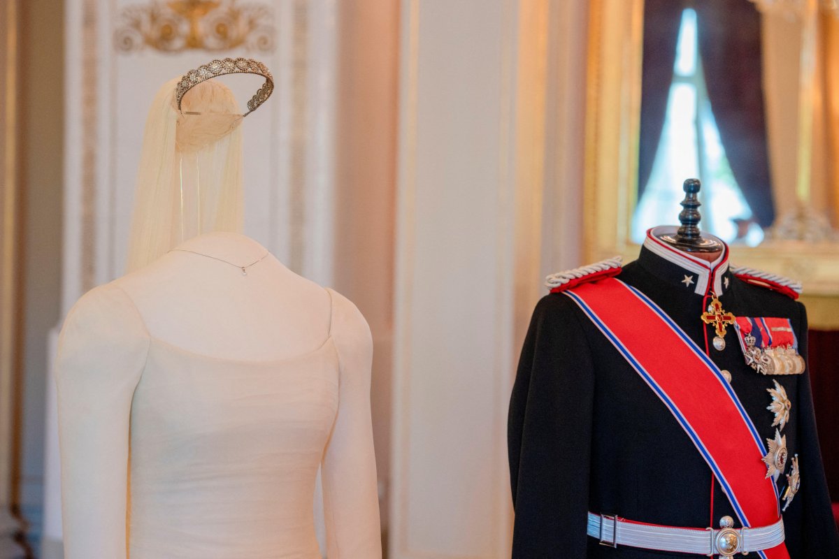 The uniform and dress worn by Crown Prince Haakon and Crown Princess Mette-Marit on their wedding day are displayed at the Royal Palace in Oslo on June 18, 2026 (Stian Lysberg Solum/NTB/Alamy)