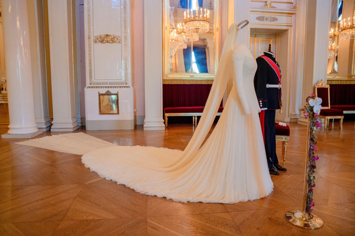 The uniform and dress worn by Crown Prince Haakon and Crown Princess Mette-Marit on their wedding day are displayed at the Royal Palace in Oslo on June 18, 2026 (Stian Lysberg Solum/NTB/Alamy)