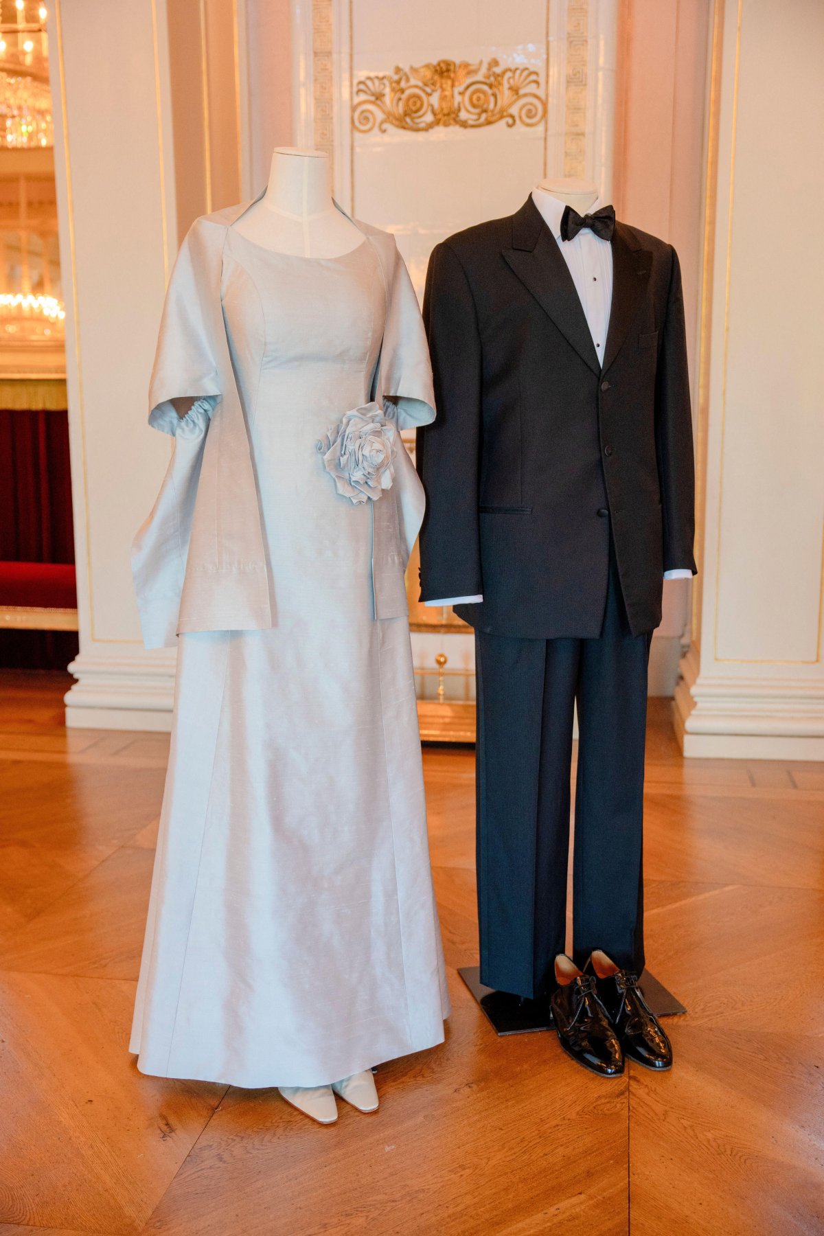 The tuxedo and dress worn by Crown Prince Haakon and Crown Princess Mette-Marit for a gala on the night before their wedding are displayed at the Royal Palace in Oslo on June 18, 2026 (Stian Lysberg Solum/NTB/Alamy)
