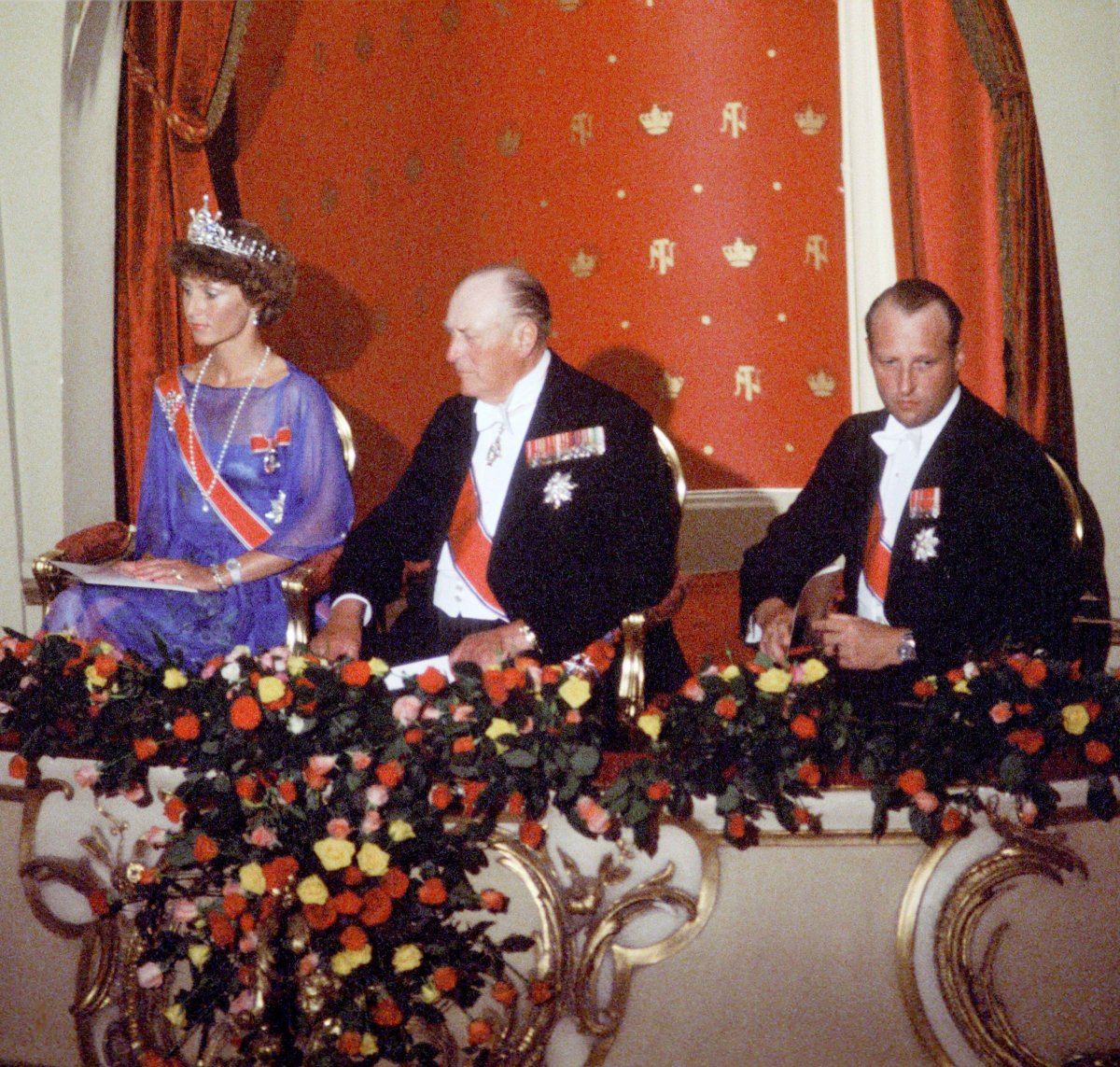 King Olav V of Norway, with Crown Prince Harald and Crown Princess Sonja, attends a performance in the National Theater in Oslo in honor of his 75th birthday, 1978 (NTB/Alamy)