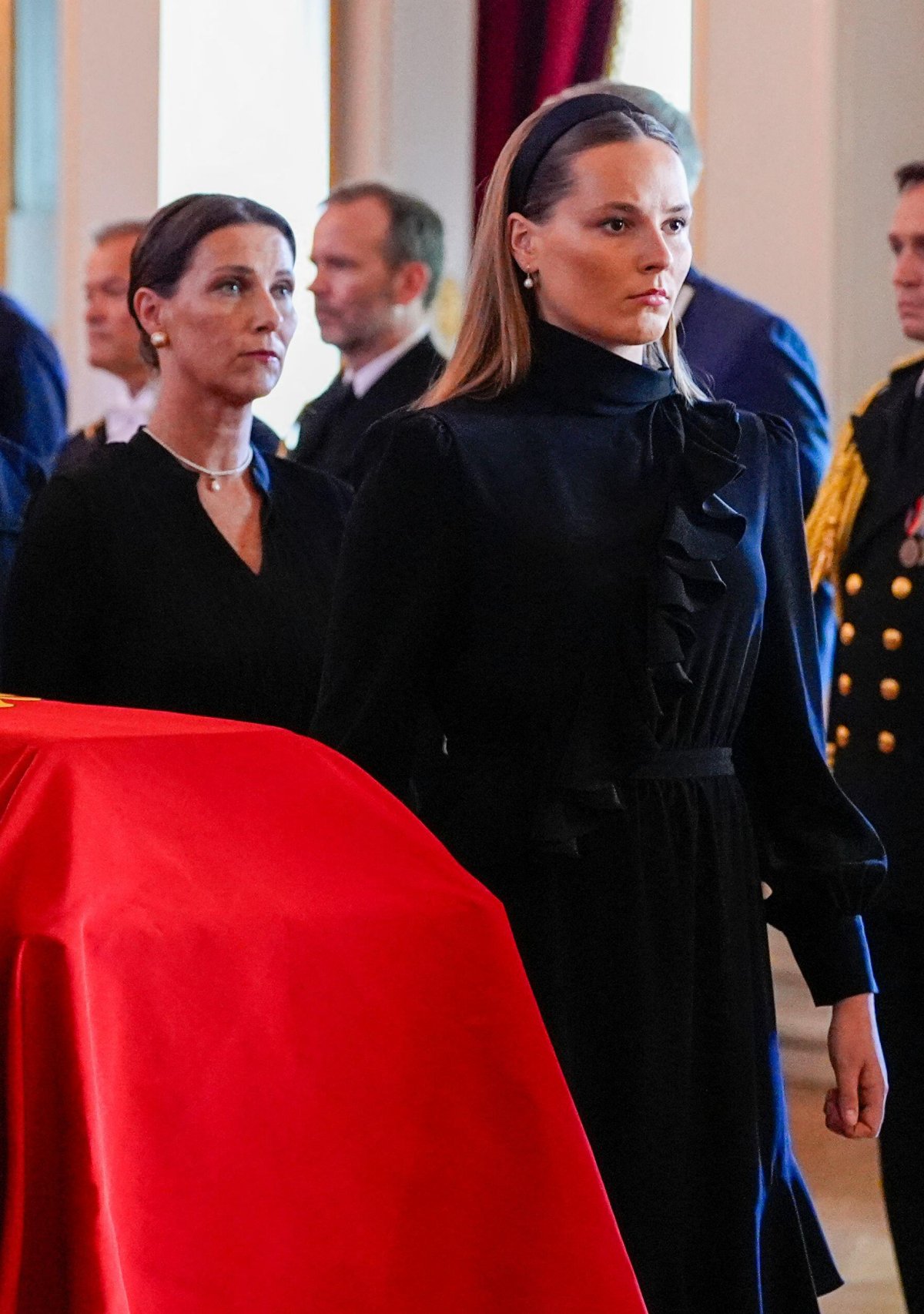 Crown Princess Ingrid Alexandra and Princess Martha Louise bring the coffin of King Harald V of Norway into the Royal Chapel at the Royal Palace in Oslo on August 31, 2026 (Lise Åserud/NTB/Alamy)