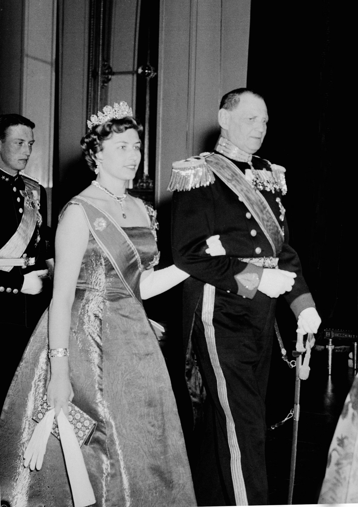 Princess Astrid of Norway and King Frederik IX of Denmark attend a state banquet at the Royal Palace in Oslo, February 1960 (NTB/Alamy)
