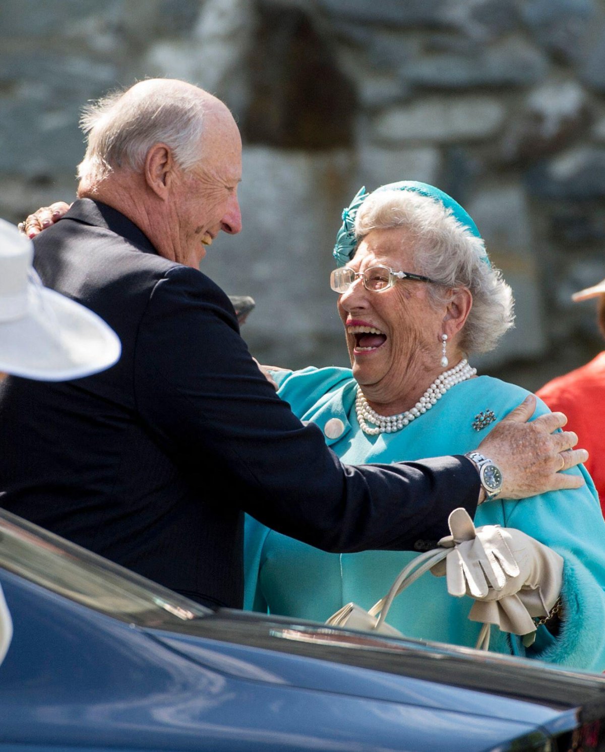 King Harald V of Norway embraces his sister, Princess Astrid, during his Silver Jubilee celebrations in Trondheim, June 2016 (Ned Alley/NTB/Alamy)