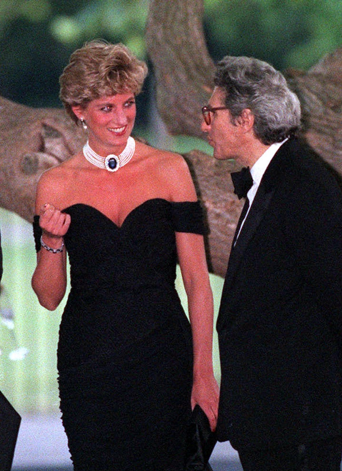The Princess of Wales speaks with Lord Gowrie as she arrives for a reception and dinner at the Serpentine Gallery in London on June 29, 1994 (Martin Keene/PA Images/Alamy)